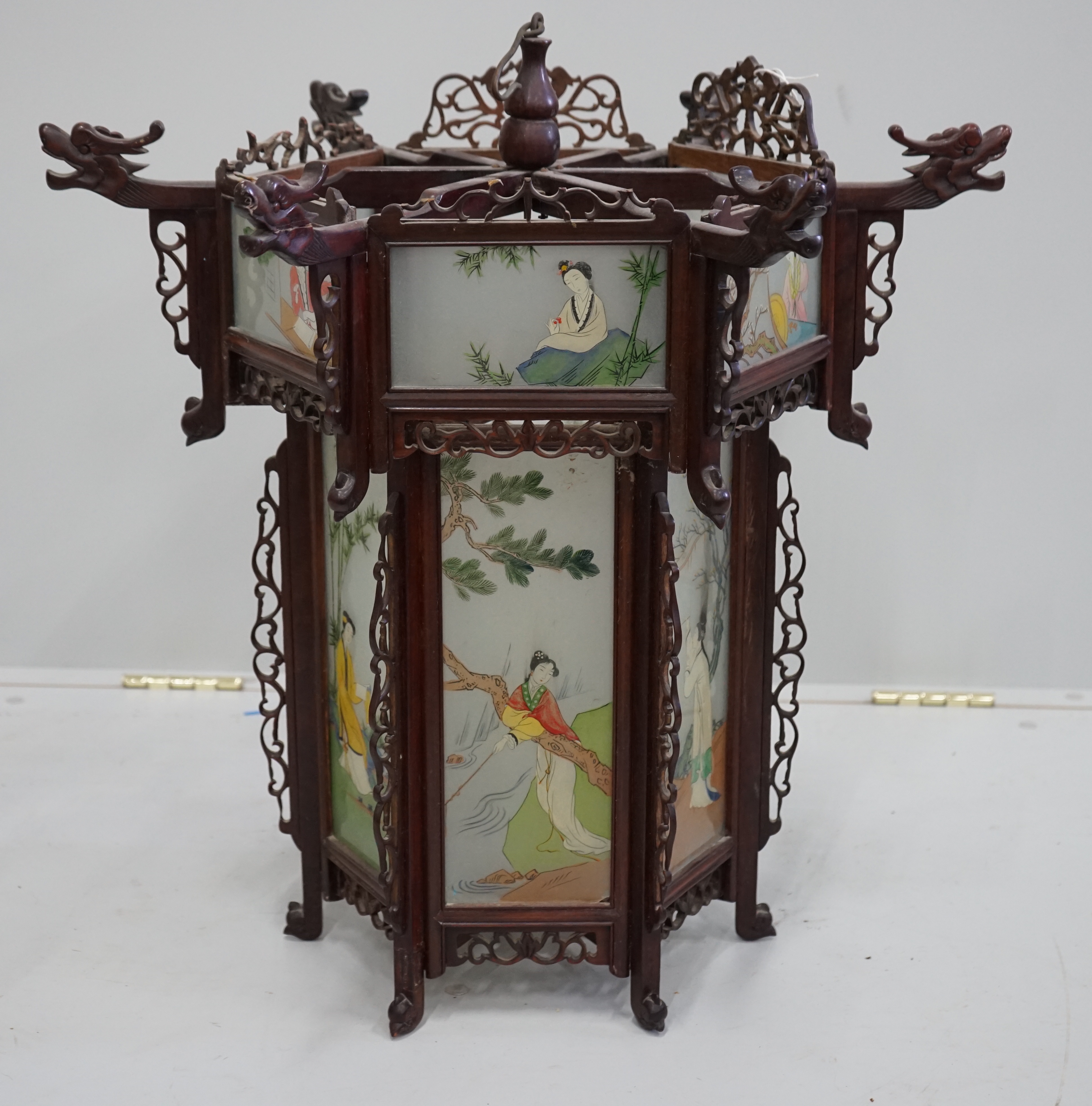 A Chinese hexagonal glass and hardwood lantern, width 62cm, height 58cm